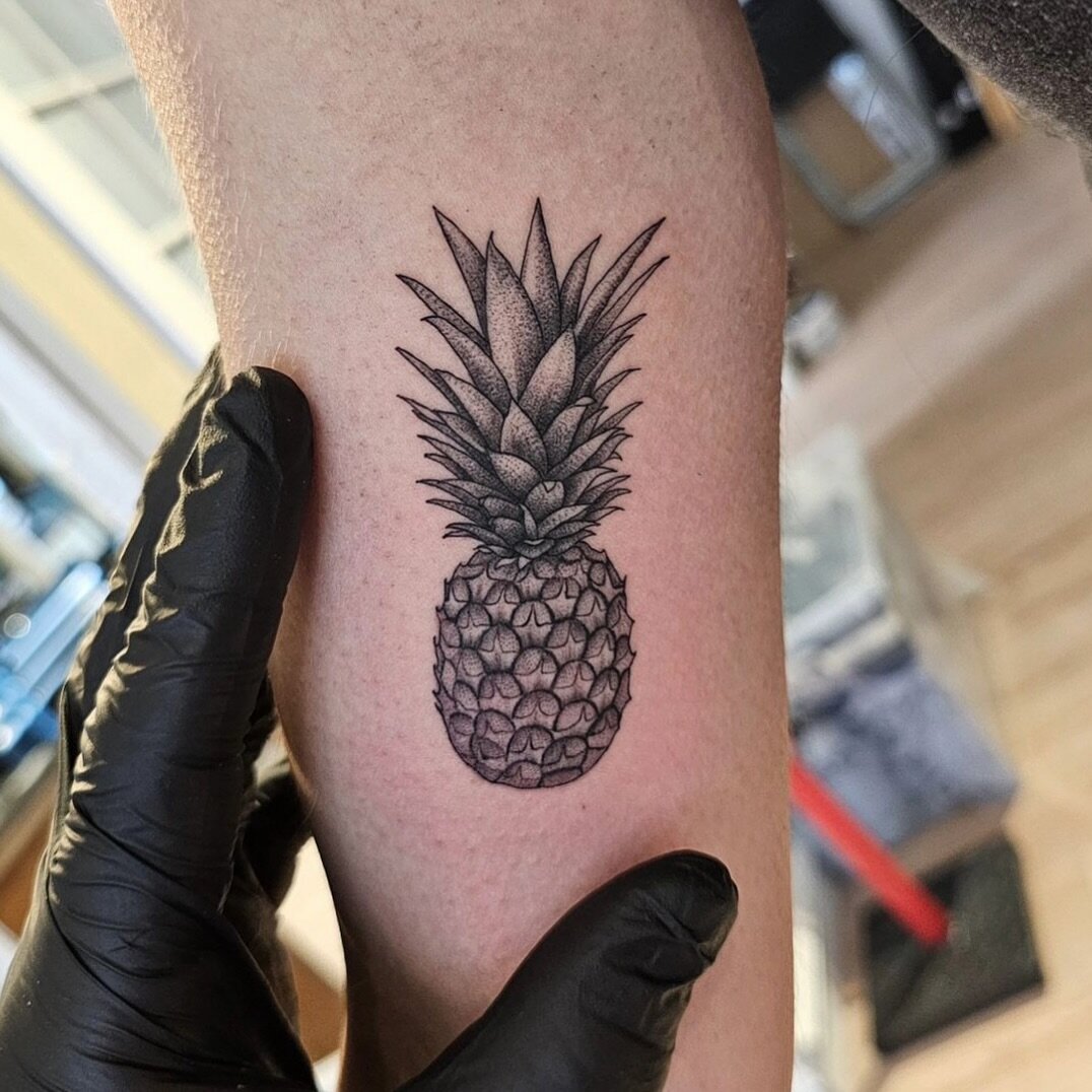Pineapple tattoo.